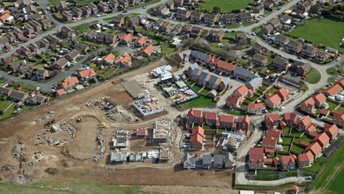 Aerial view of housing development under construction.